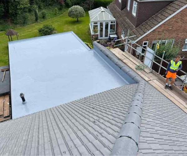 This is a photo of a newly installed hip roof, with a combined liquid covered flat roof. Work carried out by KLJ Roofing Towcester