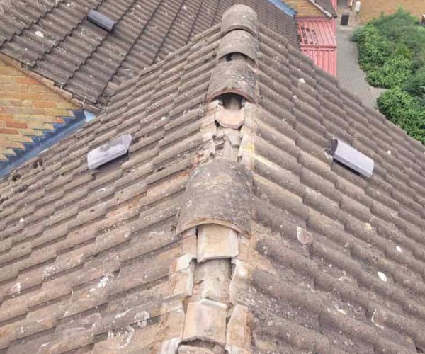 This is a photo if a roof ridge which has missing tiles. The ridge tiles are being replaced by KLJ Roofing Towcester